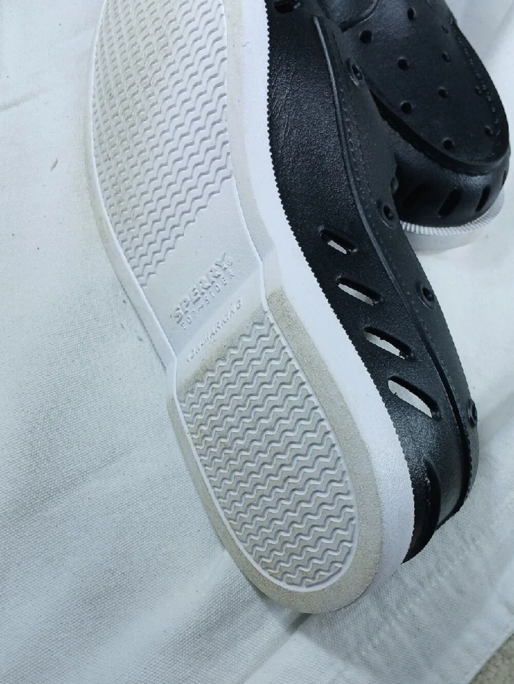 Sperry Black Perforated Slip-On Boat Shoes with White Sole